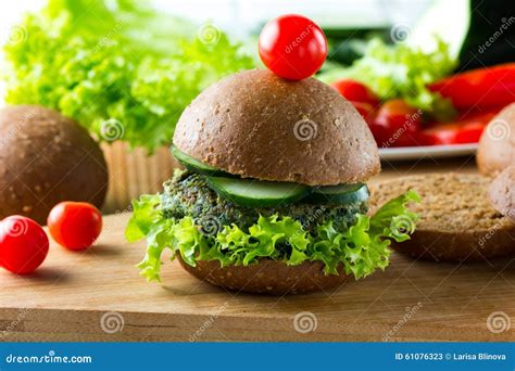 Vegan Spinach Burgers With Rye Bread Cucumber And Lettuce Stock Image