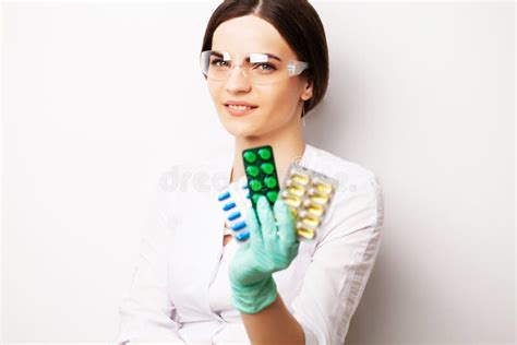 Sexual Health A Doctor In A White Coat Holding A Pill For A Healthy Sex Life Of Men Stock Image