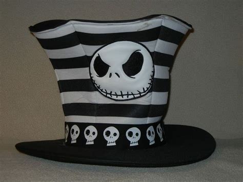 A Black And White Striped Hat With A Jack Skellingy Face On The Front