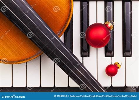 Top View Close Up Shot Of Piano Keyboardold Violin And Christmas