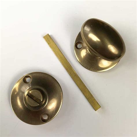 Aston Oval Thumb Turn And Release Antique Brass Unlacquered Broughtons Lighting And Ironmongery