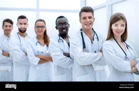 Beautiful group doctors together smiling isolated white Stock Photo - Alamy