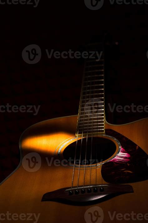 Acoustic guitar on black background 11972122 Stock Photo at Vecteezy