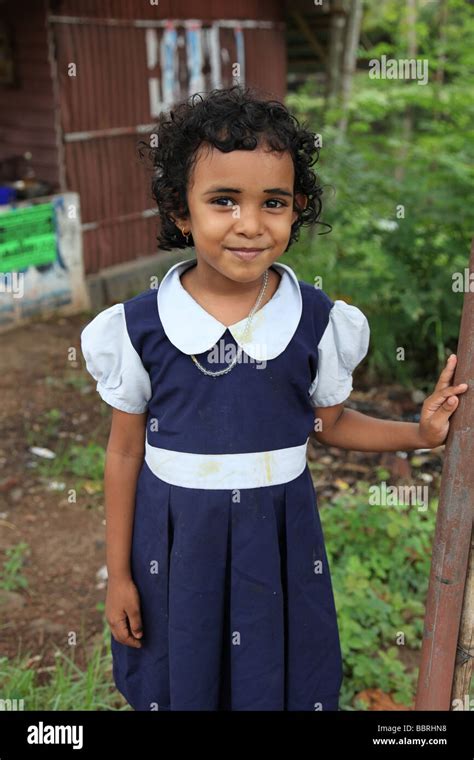 Poor Indian schoolgirl wearing her school uniform Stock Photo - Alamy