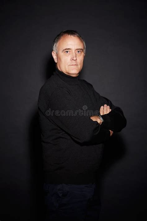 Hes Naturally Confident Studio Portrait Of A Mature Man Isolated On