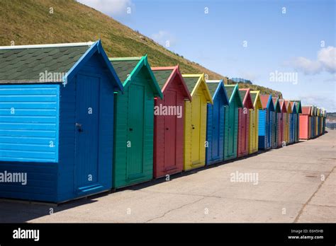 Brightly Coloured Beach Huts On The Sea Front At Whitby Yorkshire