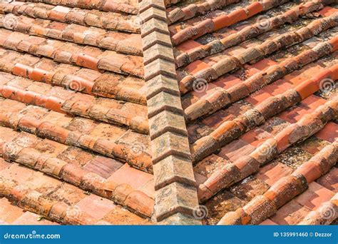 Ceramic Orange Clay Tiles On The Roof Of A Building Corner Stock Photo