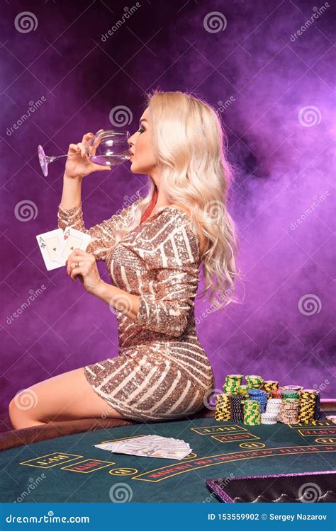 Blonde Woman With A Perfect Hairstyle And Bright Make Up Is Posing With Playing Cards In Her