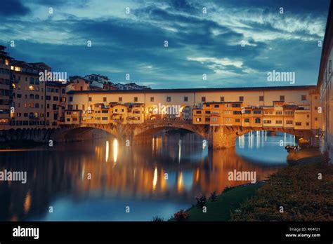 Ponte Vecchio Over Arno River At Night In Florence Italy Stock Photo