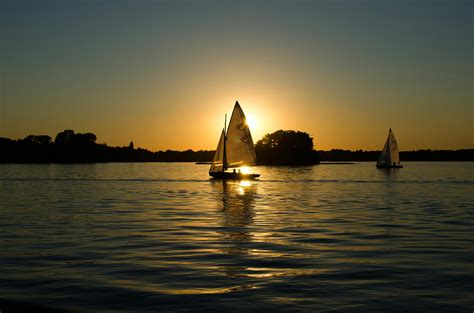 Sailboat On Body Of Water During Sunset · Free Stock Photo