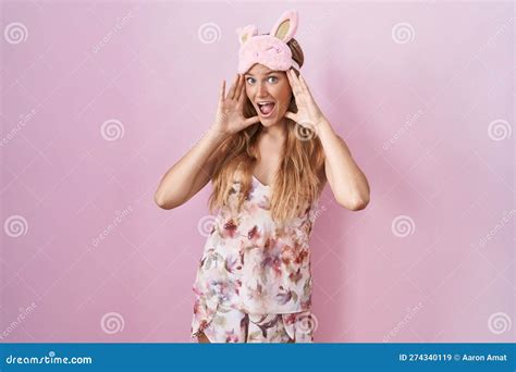 Young Caucasian Woman Wearing Sleep Mask And Pajama Smiling Cheerful