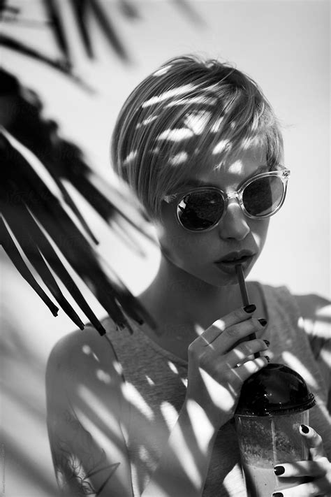 Young Woman With Sunglasses And Fresh Berry Smoothie By Stocksy