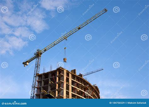 Preparing To Pour A Bucket Of Concrete Into Formworktower Crane