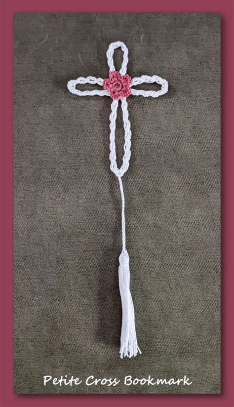 A Crocheted Cross With A Tassel Hanging From It S Side On A Gray Background