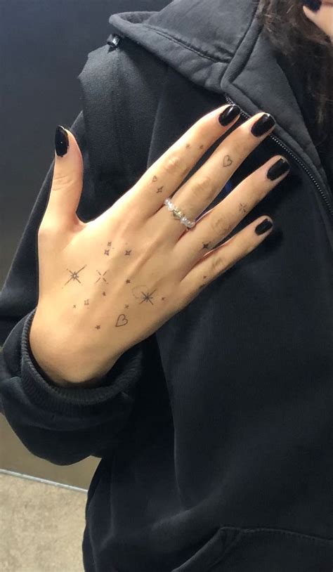 Stars And Moon Hand Tattoos