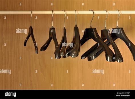 Black hangers in the closet Stock Photo - Alamy