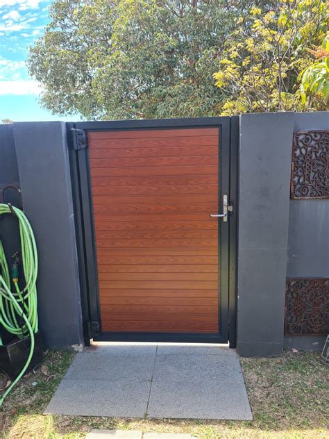 Aluminium Woodgrain Slat Gate — Craftsman Fencing Perth