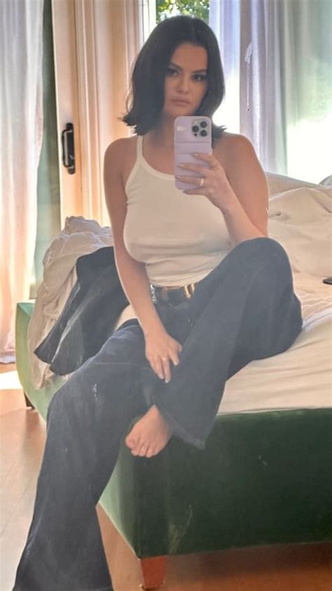 Selena Gomez Flaunts Her Curves In Tight Jeans And White Tank Top After