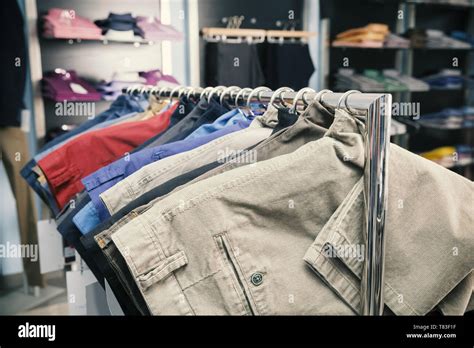 Mens Pants Hanging In Wardrobe Stock Photo Alamy