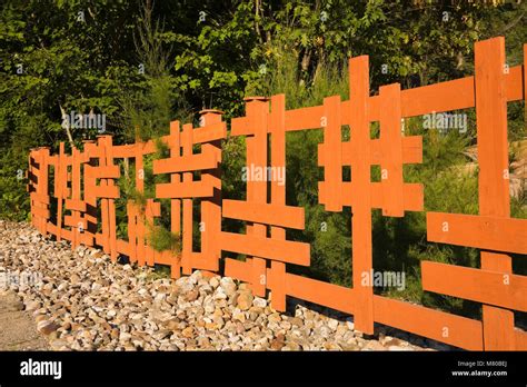 Wooden Japanese Style Fence In A Landscaped Front Yard Zen Garden In