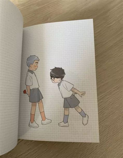 An Open Book With Drawings Of Two People In The Middle And One Person