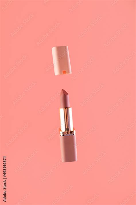 Levitation Nude Matte Lipstick And Cap On A Pink Background In A Pink And Gold Tube Top View
