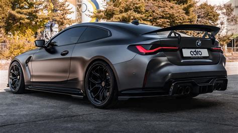 Black matte BMW M4 2022 rear view · free photo