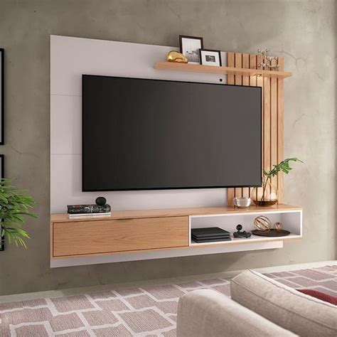 A Flat Screen Tv Mounted To The Side Of A Wall In A Modern Living Room