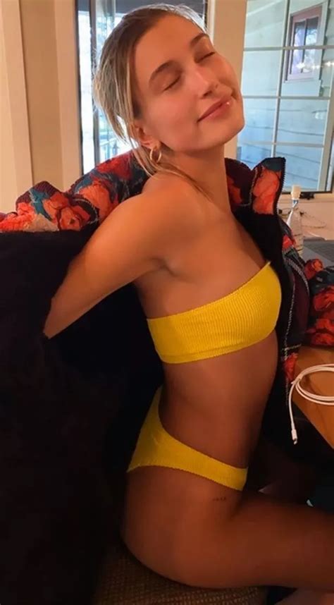 Hailey Bieber Peels Off Coat As She Exposes Figure In Teeny Yellow