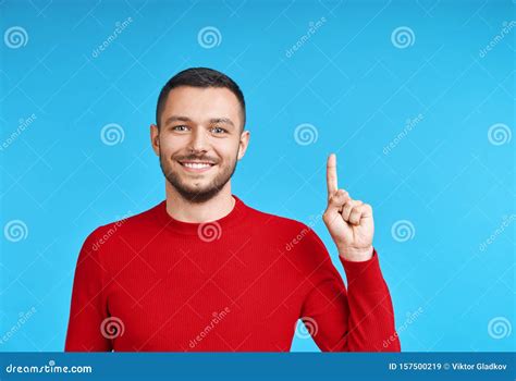 Handsome Happy Man Pointing His Finger Showing Empty Copy Space Stock