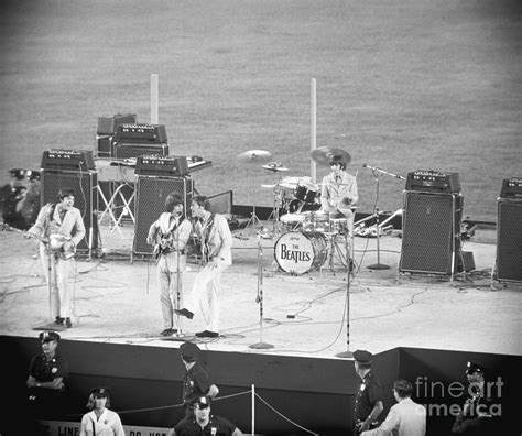 Beatles Performing At Shea Stadium By Bettmann