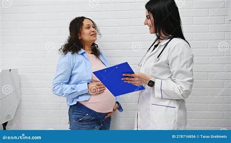 Pregnant Woman Visiting Gynecologist Obstetrician Doctor At Maternity