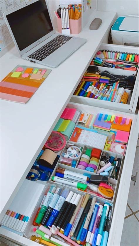 An Open Drawer With Pens Pencils Markers And Other Office Supplies On It