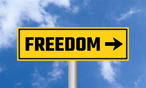 Premium Photo Freedom Road Sign On Cloudy Sky Background