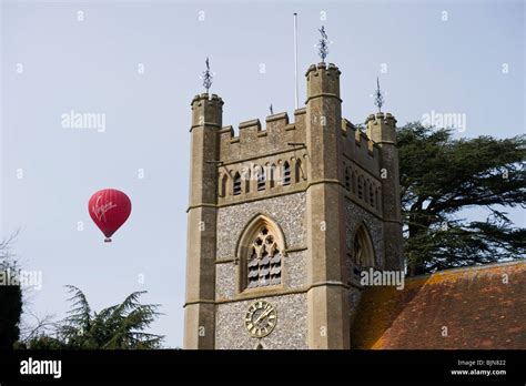 Virgin Hot Air Balloon Passing Near To The Church Tower Of St Mary The