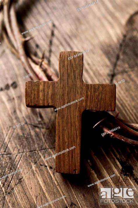 Closeup Of A Small Wooden Cross And A Depiction Of The Crown Of Thorns