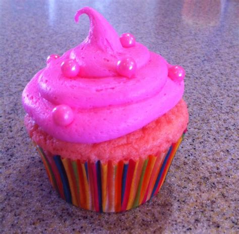 Pink Velvet Cupcake With Hot Pink Vanilla Icing And Pink Candy Pearls