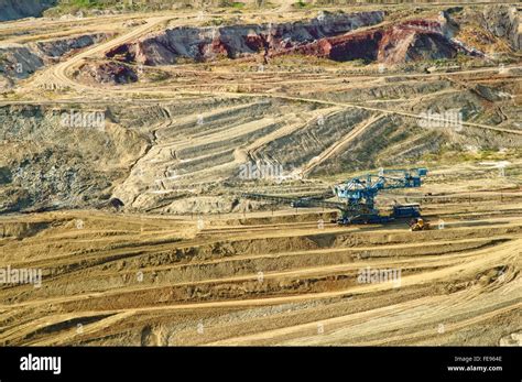 The Wall Surface Mine With Exposed Colored Minerals At The Bottom Of