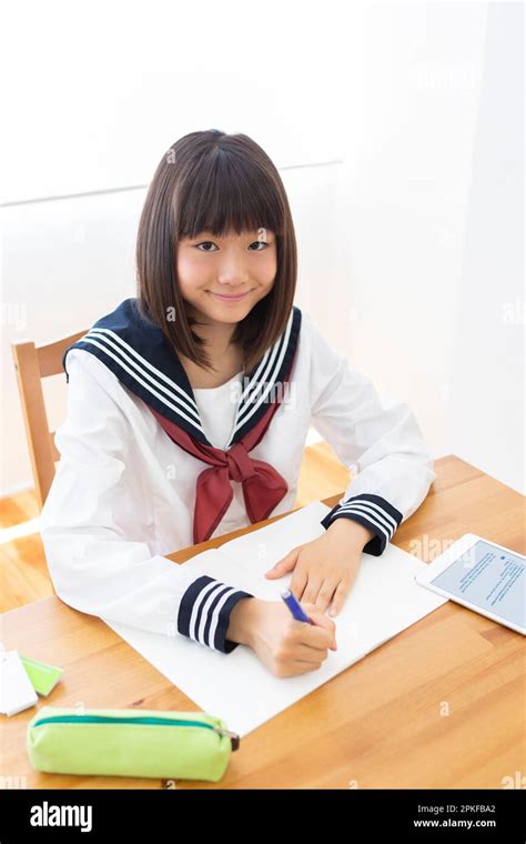 Junior high school students studying at home Stock Photo - Alamy