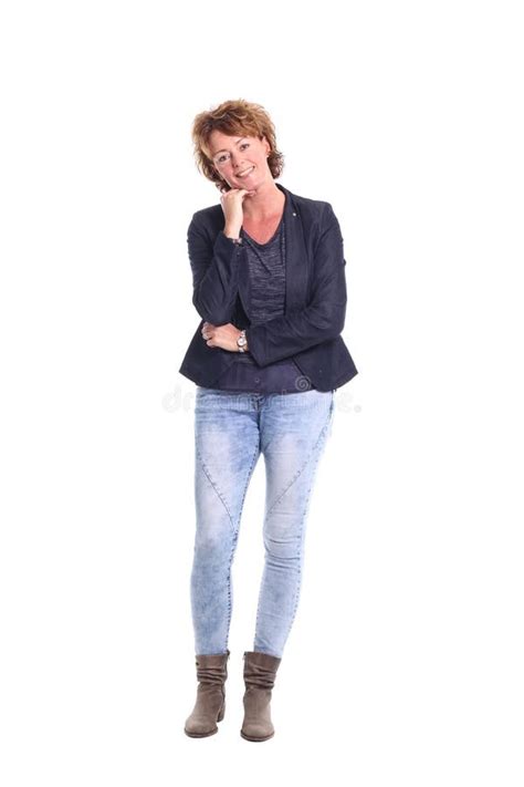 Beautiful Happy Mature Woman In Front Of A Background Stock Photo