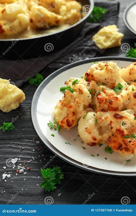 Roasted Cauliflower With Cheddar Cheese Sauce And Herbs Stock Photo