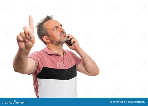 Adult Man On The Phone Making Wait Gesture With Index Finger Stock