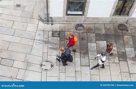 Pilgrims And Tourists Walking In The Streets Of The Final Destination