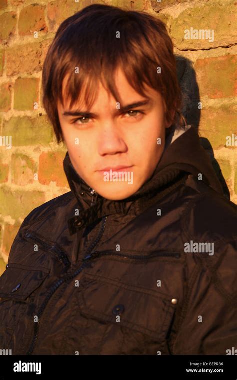 Beautiful Boy With Green Eyes Stares Challengingly Stock Photo Alamy