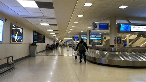 Walking From The Baggage Claim To The Cta Orange Line At Midway Airport