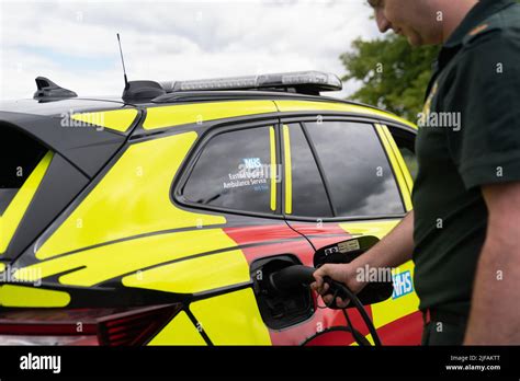 A Paramedic Charges One Of The New Electric Rapid Response Vehicles