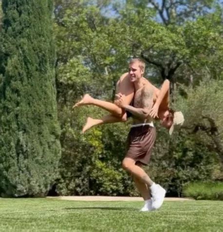 Hailey Bieber Dons Tiny Bikini As She S Thrown Over Justin S Shoulders