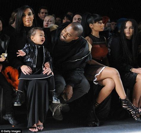 North West Gets Lifted Up By Kim Kardashian To Push Elevator Button