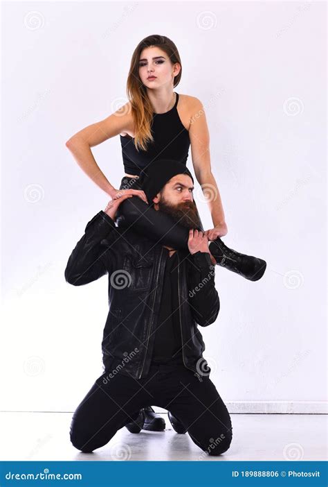 Rock Lovers Fashion Girl Puts Leg Around Bearded Man Neck Stock Photo