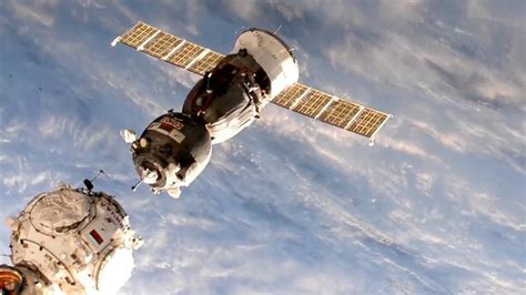 Crewed Soyuz Spacecraft Moved To New Space Station Docking Port Youtube